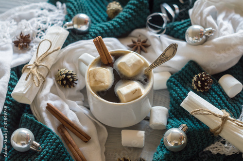 A cup of coffee and marshmallow in the New Year table setting