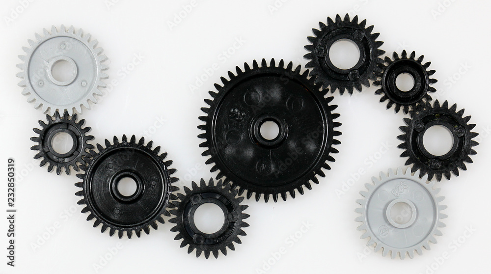 Several gears that are in connection with each other on a white background Several gears that are in connection with each other on a white background