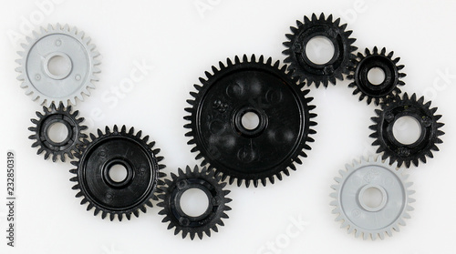 Several gears that are in connection with each other on a white background