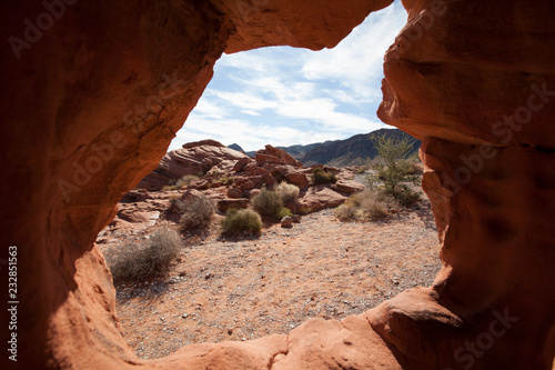 View of the arid desert through rock erosion in Valley of Fire, Nevada