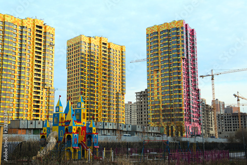 Large residential apartment building with a coloured façade.Modern residential urban architecture. © karitap