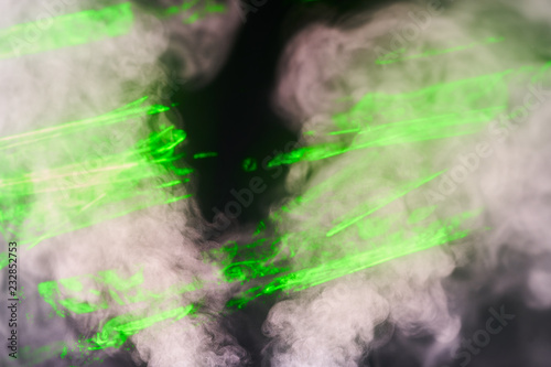 Water vapor with the effects of the laser beam and a multicolored light