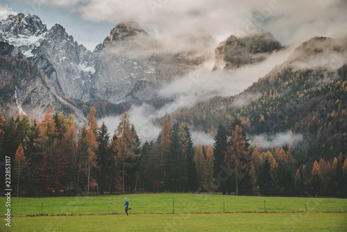 Fototapeta Naklejka Na Ścianę i Meble -  Sport photo, active life in outdoor. Man train in autumn mountains. Julian Alps, Slovenia