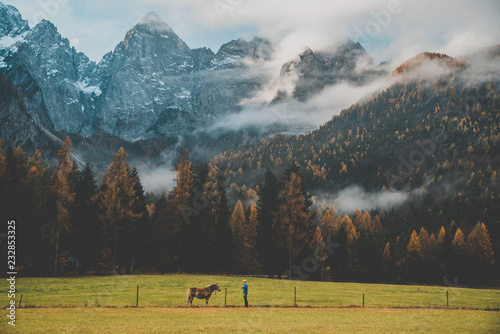 Fototapeta Naklejka Na Ścianę i Meble -  Man and horse in autumn nature.