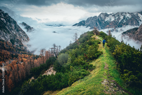 Trail runner on the green mountains ridge. photo