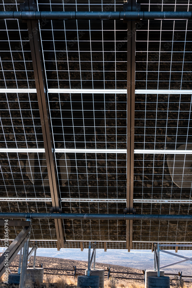 Close up of underside of solar panel installation in a dry landscape Close up of underside of solar panel installation in a dry landscape