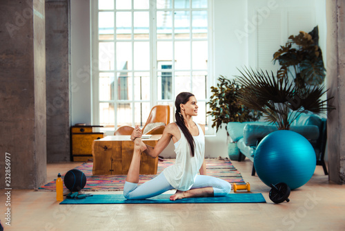 Sportive woman training at home photo