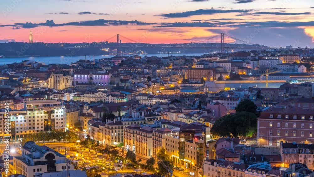 Lisbon after sunset aerial panorama view of city centre with red roofs at Autumn day to night timelapse, Portugal Lisbon after sunset aerial panorama view of city centre with red roofs at Autumn day to night timelapse, Portugal