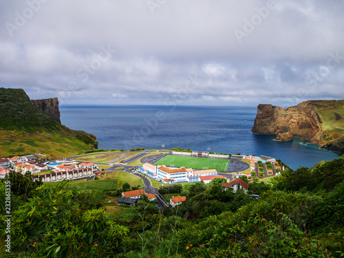 Panorama Image of soccer field and landscape next to a cliff and the atlantic sea below