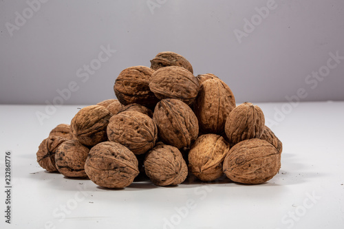 pile of walnuts on white background