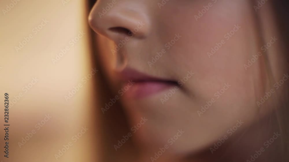 Close up of a girl's lips smile beautiful child baby face kid mouth portrait hair young communication dialogue cute pretty slow motion Close up of a girl's lips smile beautiful child baby face kid mouth portrait hair young communication dialogue cute pretty slow motion
