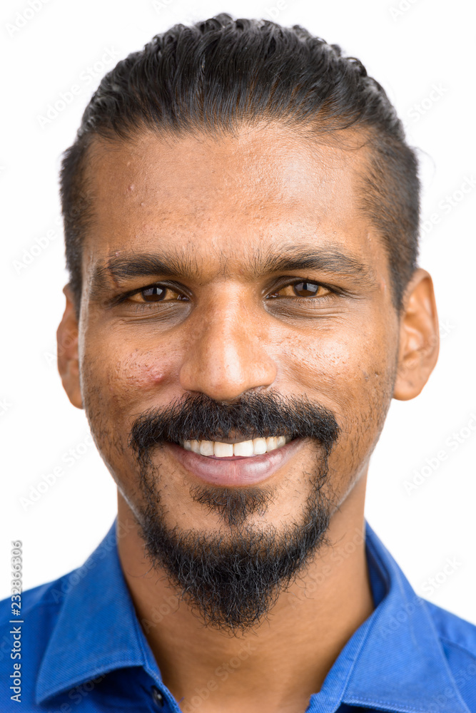 Fototapeta premium Face of young happy Indian businessman smiling