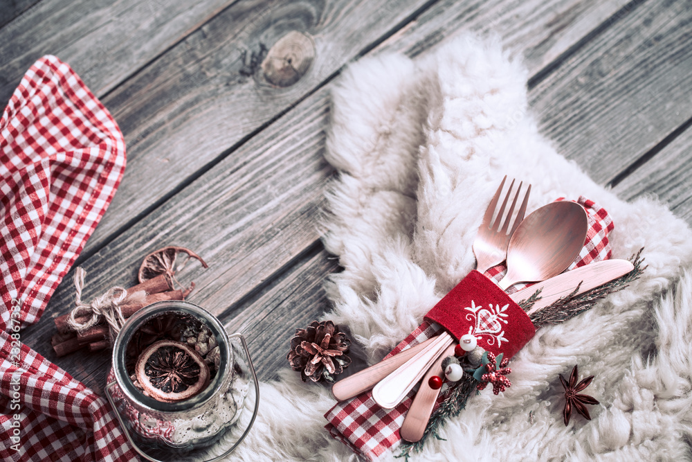 Fototapeta premium Christmas dinner cutlery with decor on a wooden background