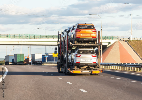 Wall Mural Car transporter carries cars along the highway