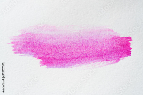 purple watercolor stain on textured paper background.