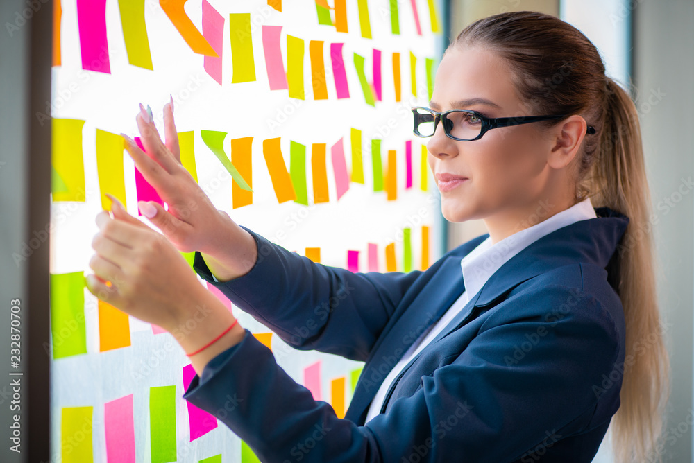 Beautiful female employee with many conflicting priorities Beautiful female employee with many conflicting priorities