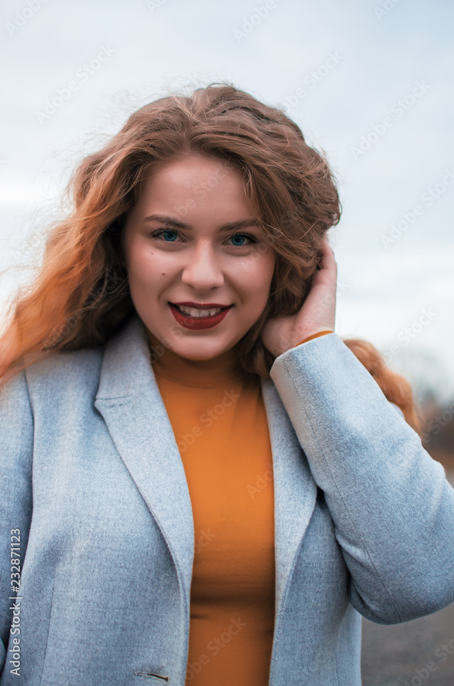 Young smiling girl with curly hair