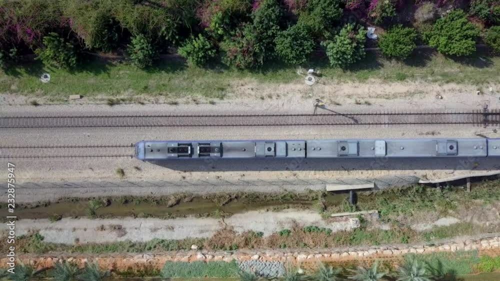 Following a Modern passenger train - Top down aerial view Following a Modern passenger train - Top down aerial view