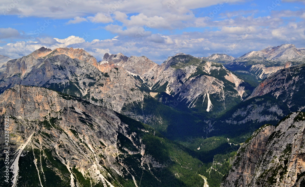 Bright peaks of Italian Alps-Dolomites illuminated by sunshine