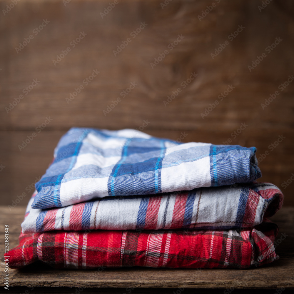 shirts plaid on wooden background shirts plaid on wooden background