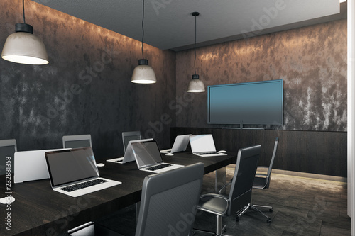 Dark meeting room with device screens © Who is Danny