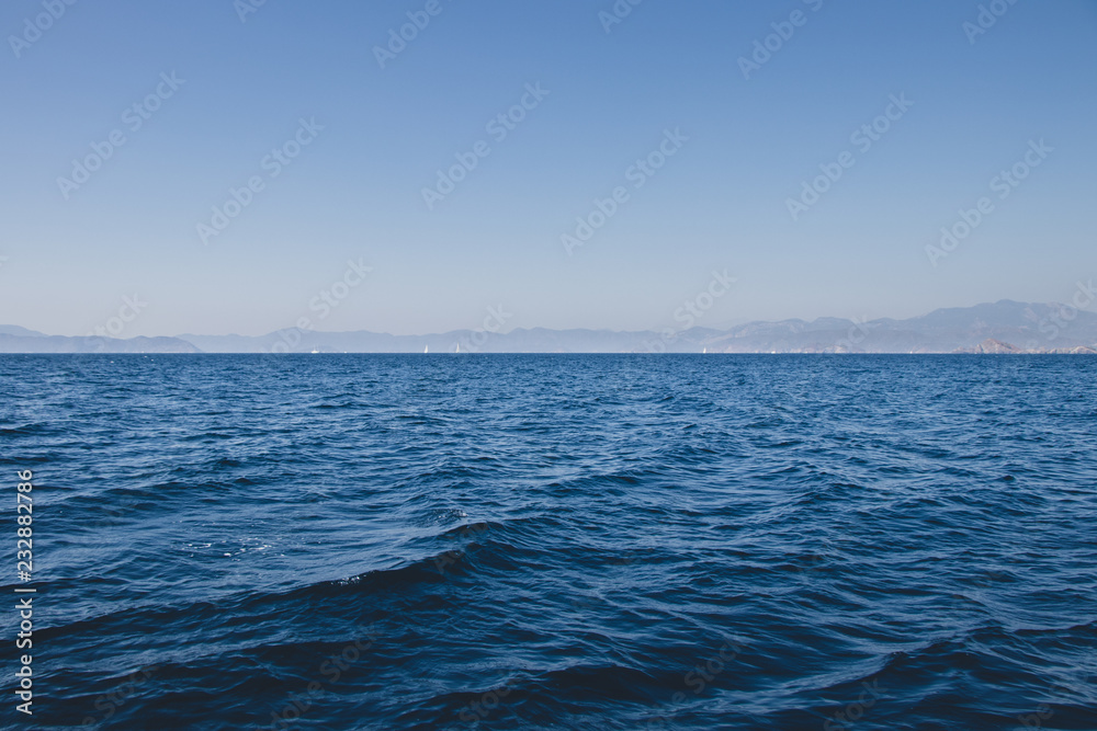 Fototapeta premium Sea, Distant Land, and Sky