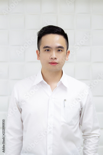 Smart Asian young business man in formal shirt looking at something. Free Download Smart Asian young business man in formal shirt looking at something. - GFXLoad