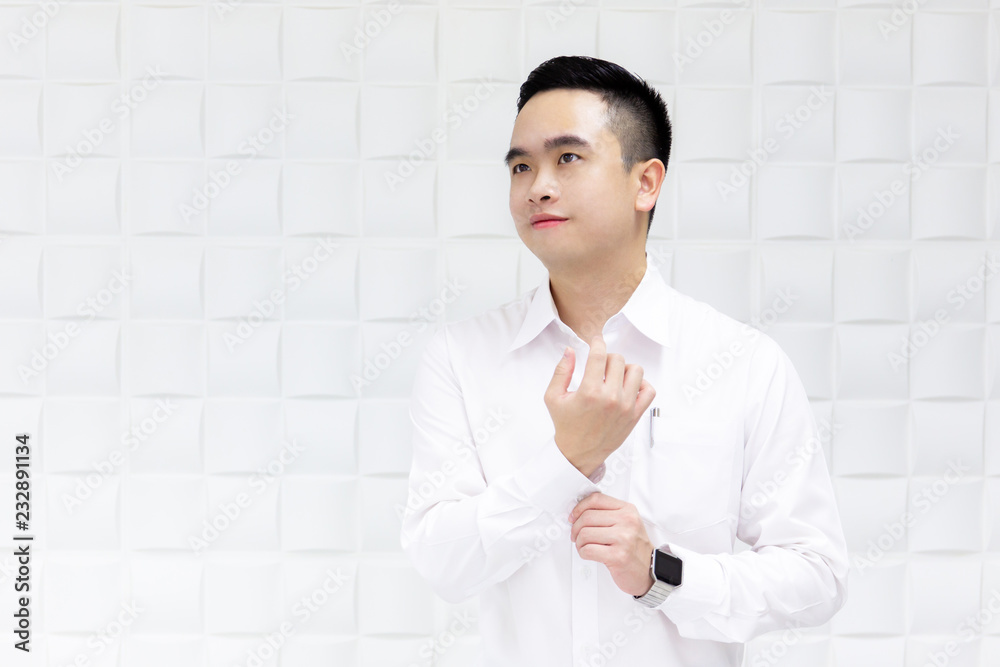 Smart Asian young business man in formal shirt looking at something. Smart Asian young business man in formal shirt looking at something.