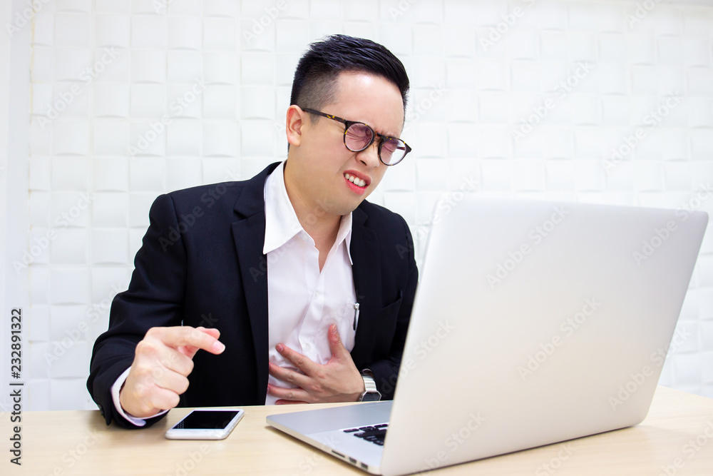 Asian business man in heart attacking from hard working for a long time. Workaholic and healthcare concept. Asian business man in heart attacking from hard working for a long time. Workaholic and healthcare concept.