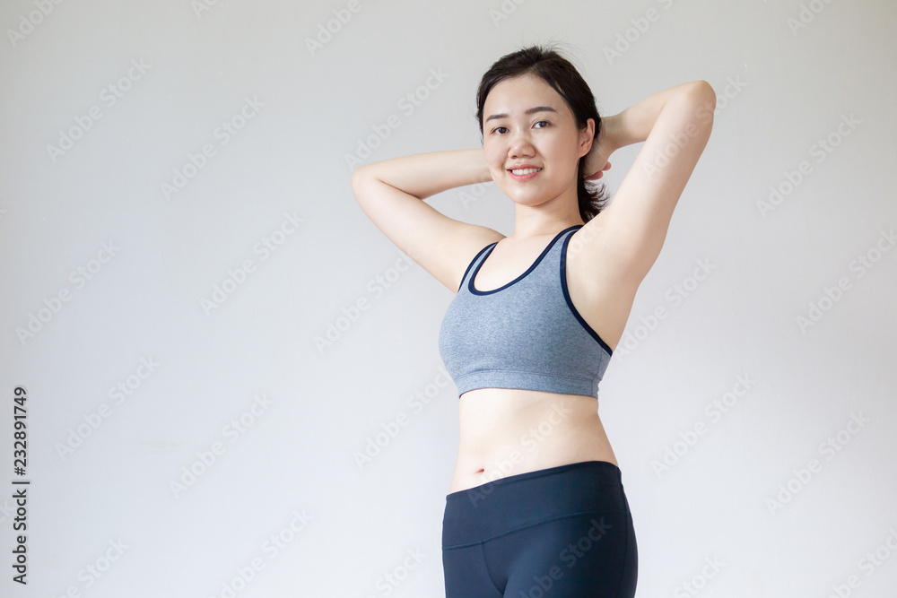 Portrait of slim beautiful Asian girl in training suit close up. Portrait of slim beautiful Asian girl in training suit close up.