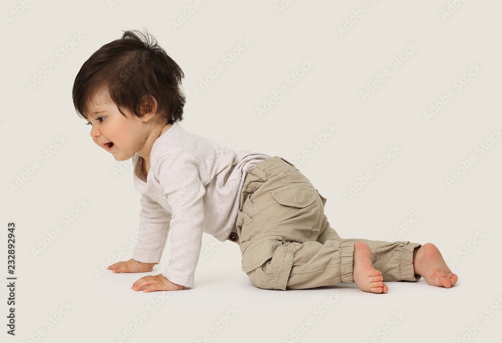 Portrait of a cute sweet baby crawling in the studio Portrait of a cute sweet baby crawling in the studio