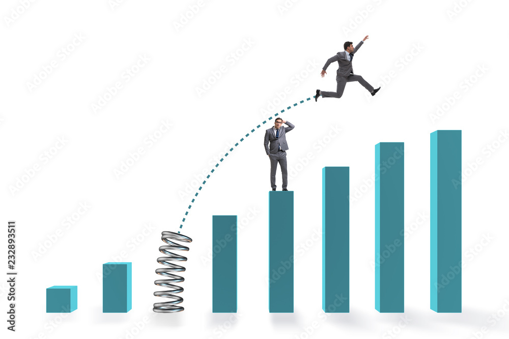 Businessman outperforming his competition jumping over Businessman outperforming his competition jumping over