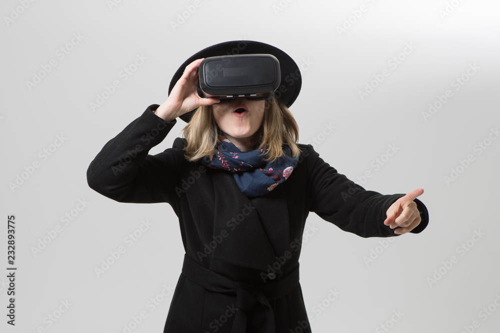 Woman uses a virtual reality glasses. VR 360. Virtual game. Woman uses a virtual reality glasses. VR 360. Virtual game.