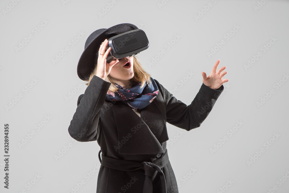 Woman uses a virtual reality glasses. VR 360. Virtual game. Woman uses a virtual reality glasses. VR 360. Virtual game.