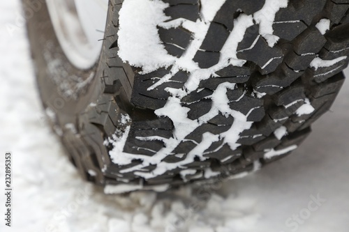 Car tyre in snow photo