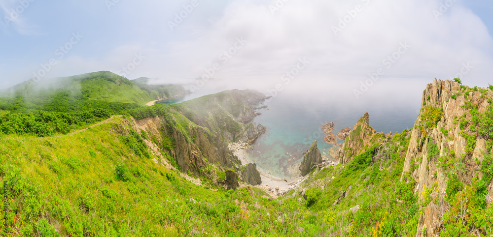 Obraz premium Mist over the sharp sea rocks