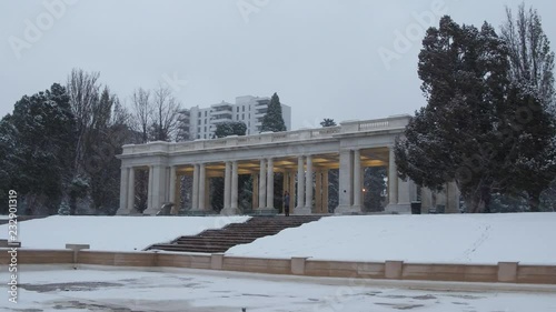 Walking through a winter snow storm at Cheesman Park in Denver, Colorado photo