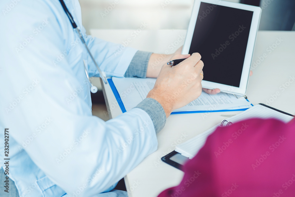 Doctors and patients sit and talk. At the table near the window in the hospital. Doctors and patients sit and talk. At the table near the window in the hospital.