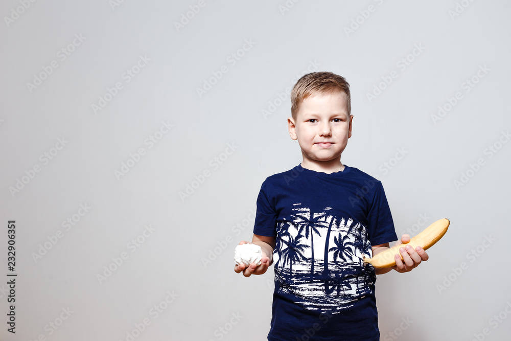 boy holding marshmallows and banana boy holding marshmallows and banana