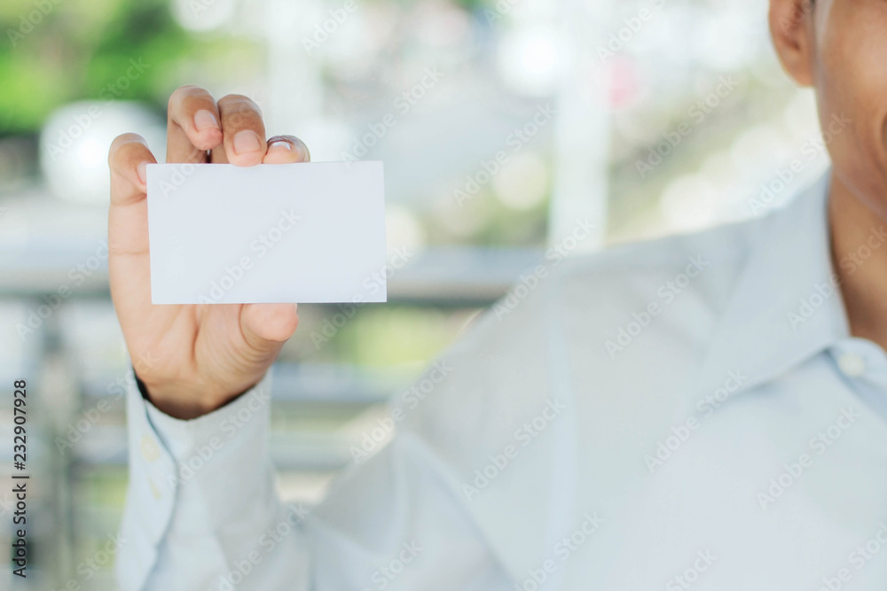 man holding white card. man holding white card.