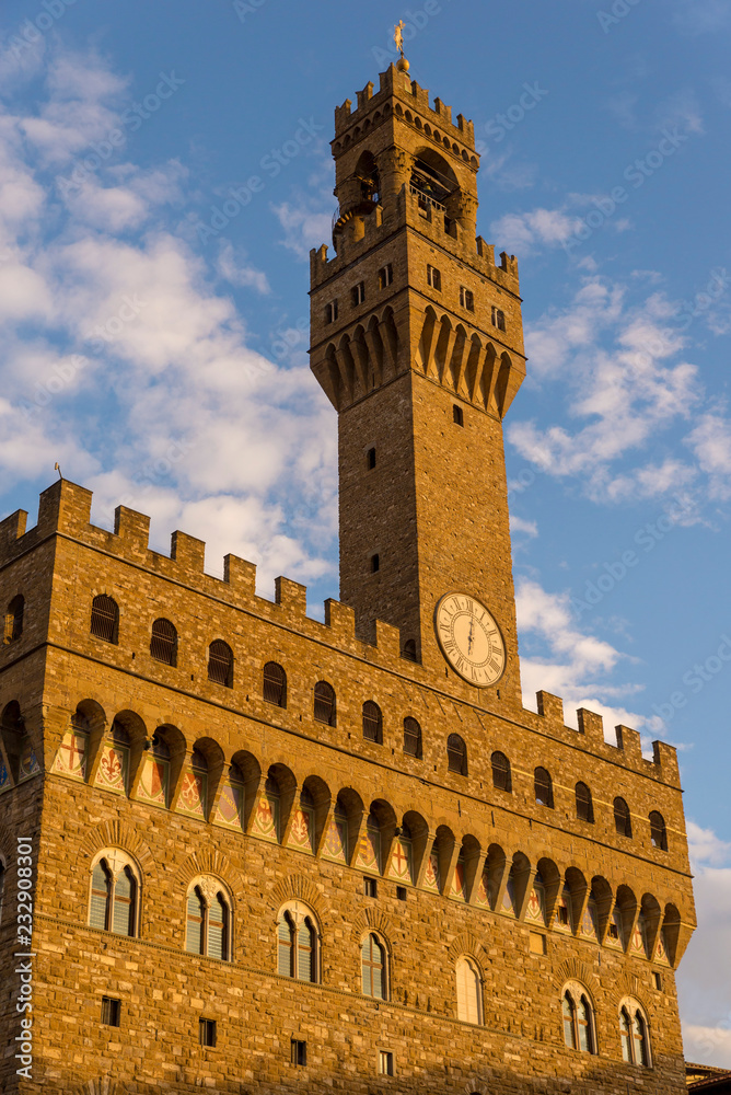 FLORENCE, ITALY - OCTOBER 28, 2018: The Palazzo Vecchio is the town hall of Florence,elo's David statue as well as the gallery of statues in the adjacent Loggia dei Lanzi.
