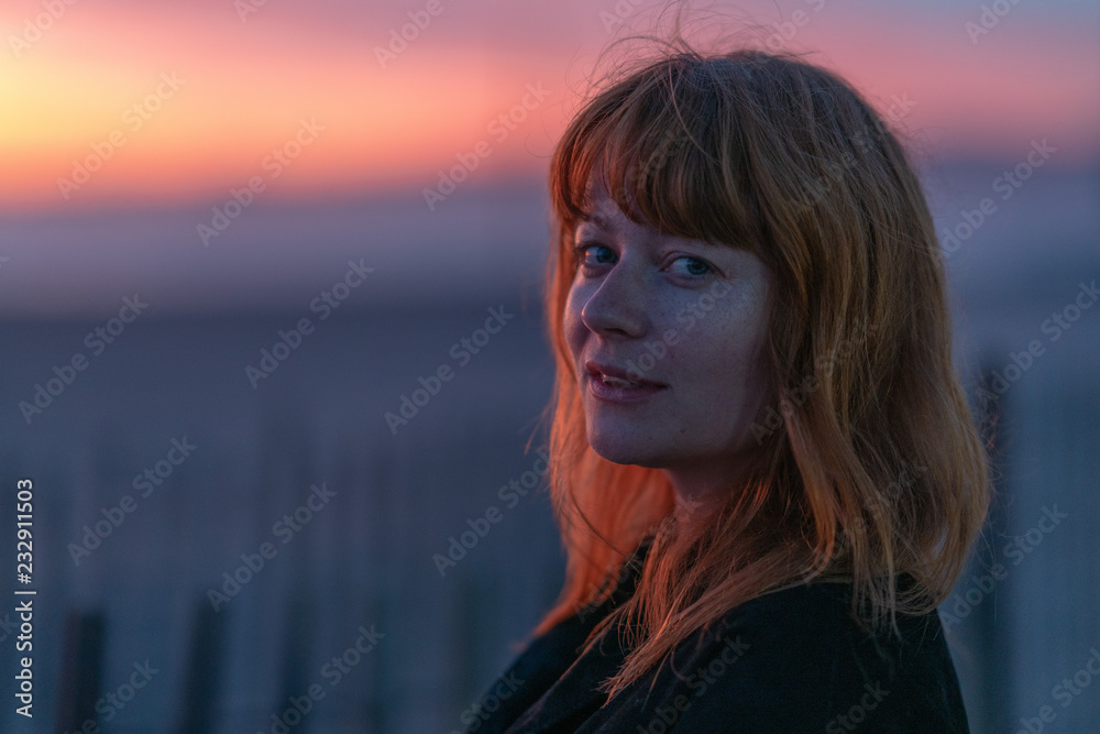 Portrait of ginger woman with blue eyes in the sunset Portrait of ginger woman with blue eyes in the sunset