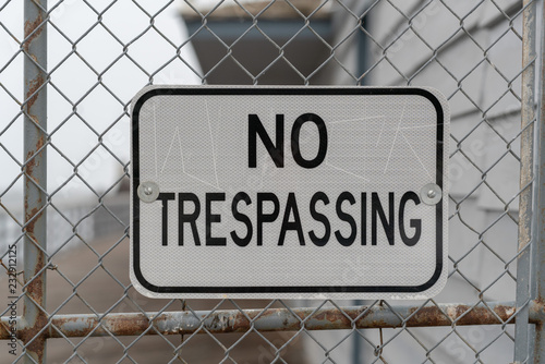 No Trespassing sign on fence