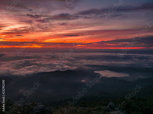 Beautiful Sunrise Sky with Sea of the mist of fog and heart shaped lake in the morning on Khao Luang mountain in Ramkhamhaeng National Park,Sukhothai province Thailand