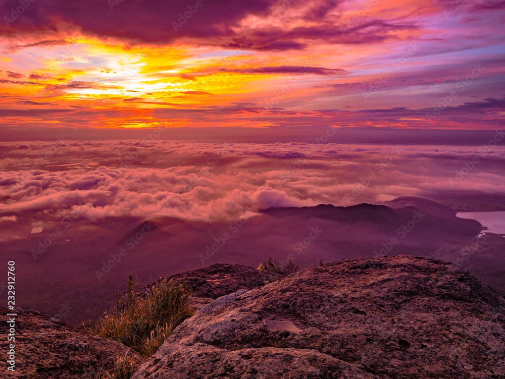 Beautiful Sunrise Sky with Sea of the mist of fog in the morning on Khao Luang mountain in Ramkhamhaeng National Park,Sukhothai province Thailand