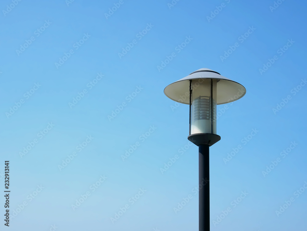 Low Angle View of Electric Lighting Post Against Clear Blue Sky Low Angle View of Electric Lighting Post Against Clear Blue Sky