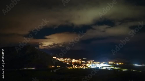 Timelapse video of Queenstown, New Zealand, from night until daylight. Beautiful clouds flying across the landscape, with stars visible in the gaps at night.