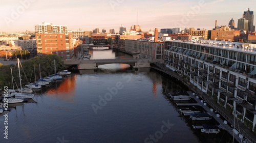 Milwaukee river in downtown  harbor districts of Milwaukee  Wisconsin  United States. Real estate  condos in downtown. Aerial view  drone flying