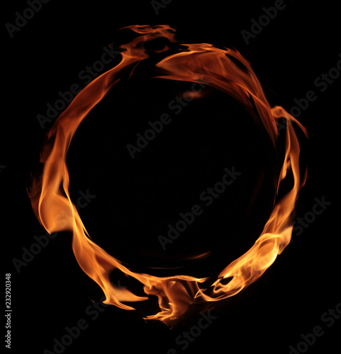 fire - a ring created by the flame and large burning flames on a black background