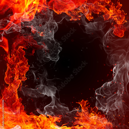 Fotografiet Fire - fiery background - red flames, sparks and waving white smoke on a black b